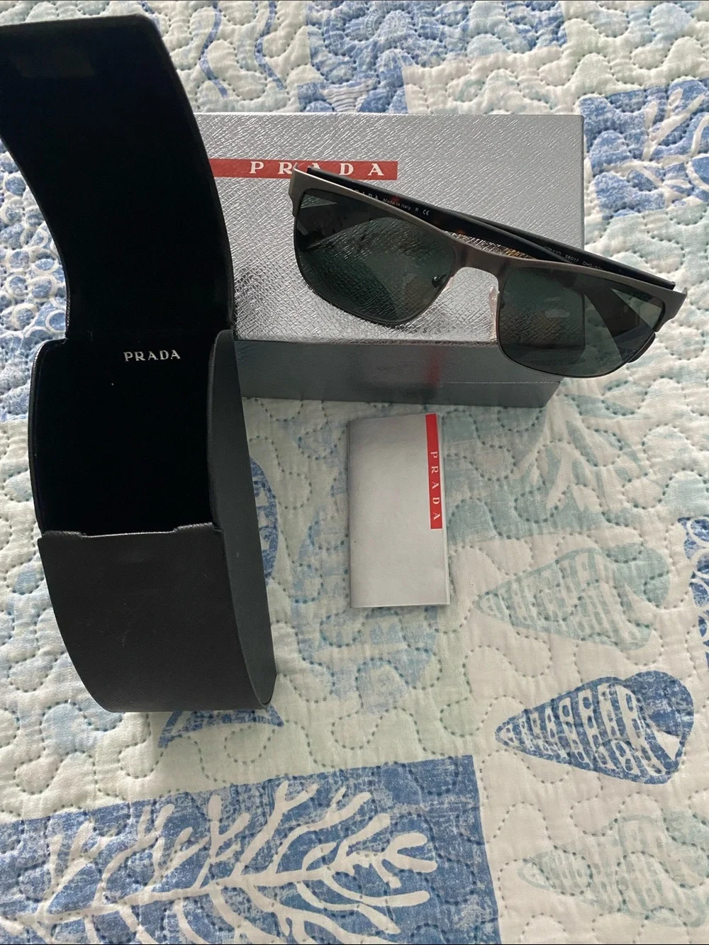 Prada Black Frame Sunglasses with Dark Green Lenses